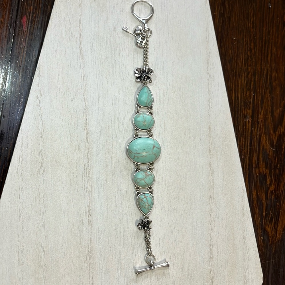 Fossil turquoise look bracelet with silver tone flowers